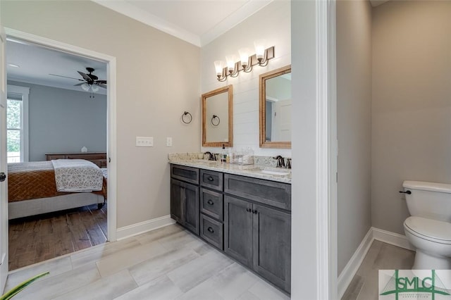 201 Cumberland Pt, Statesboro, GA 30458 - full bathroom with connected bathroom, toilet, ceiling fan, double vanity, and baseboards