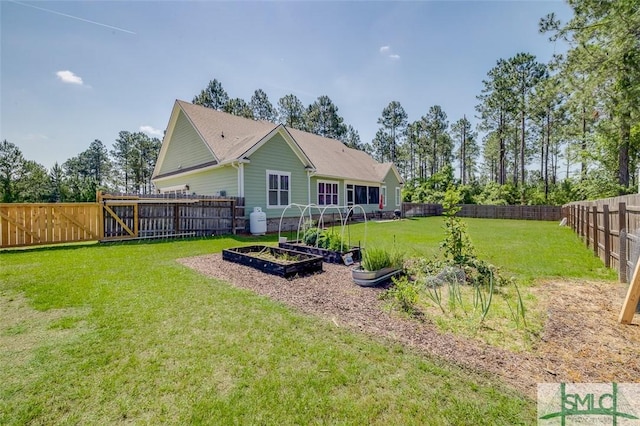 201 Cumberland Pt, Statesboro, GA 30458 - rear view of property featuring a garden
