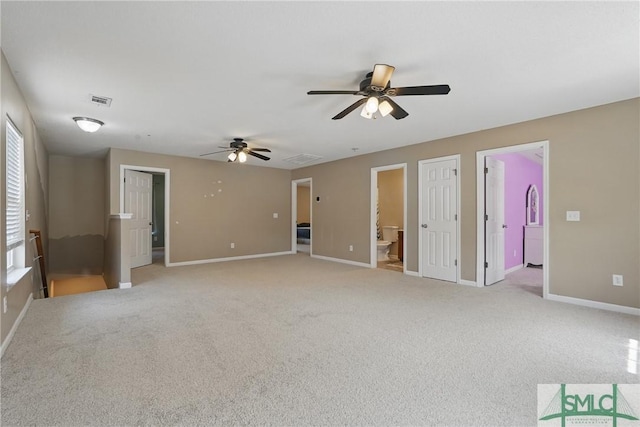 unfurnished living room featuring a ceiling fan, baseboards, and light carpet