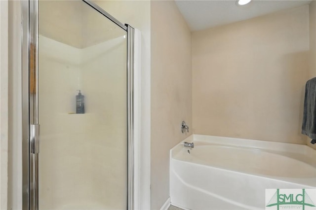 full bath with a shower stall, a bath, and recessed lighting
