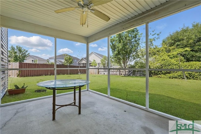 sunroom with a ceiling fan