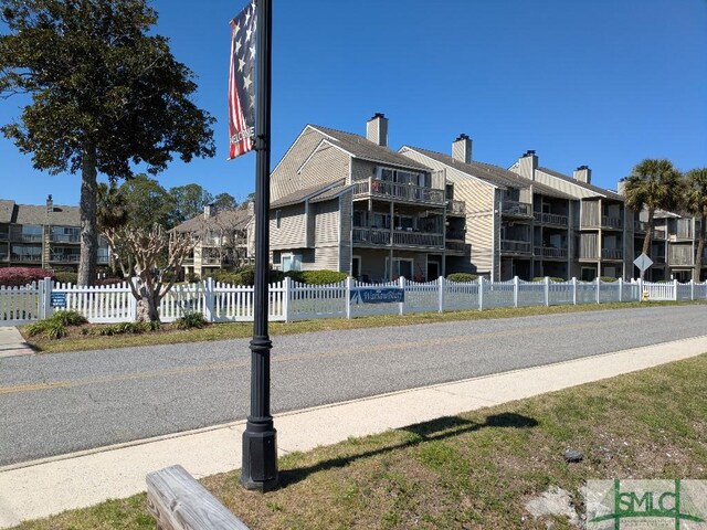 3005 River Dr Unit 401D, Savannah, GA 31404 - view of building exterior with fence