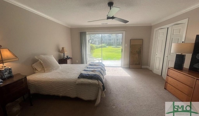 3005 River Dr Unit 401D, Savannah, GA 31404 - carpeted bedroom with access to exterior, ornamental molding, ceiling fan, a textured ceiling, and baseboards