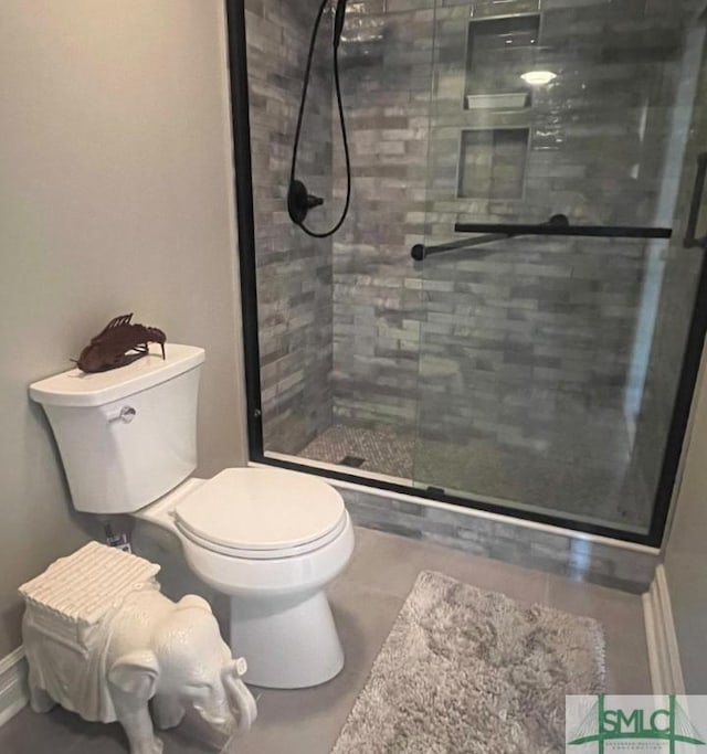 3005 River Dr Unit 401D, Savannah, GA 31404 - full bathroom with a stall shower and toilet