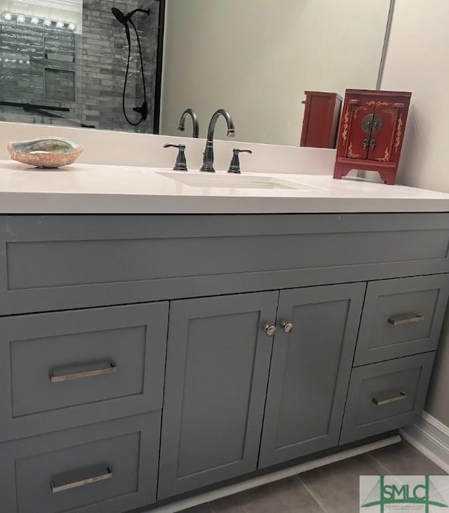3005 River Dr Unit 401D, Savannah, GA 31404 - bathroom featuring vanity and tiled shower