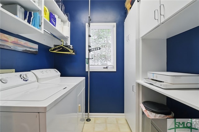 washroom featuring cabinet space, independent washer and dryer, and baseboards