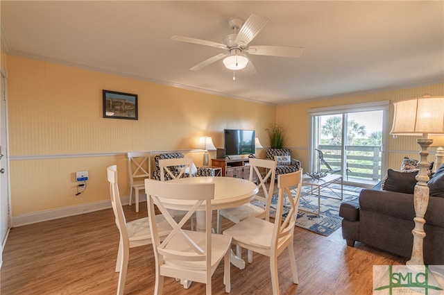 85 Van Horne Ave Unit 12A, Tybee Island, GA 31328 - dining area featuring wood finished floors, ornamental molding, a ceiling fan, and baseboards