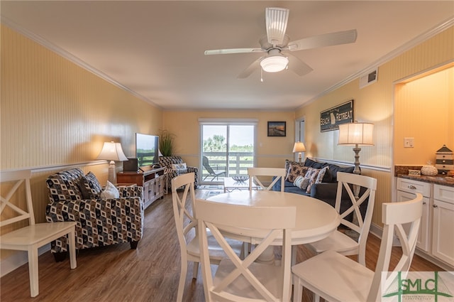 85 Van Horne Ave Unit 12A, Tybee Island, GA 31328 - dining room featuring wood finished floors, crown molding, and a ceiling fan