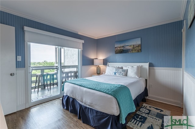 85 Van Horne Ave Unit 12A, Tybee Island, GA 31328 - bedroom featuring access to exterior, wood finished floors, crown molding, and wainscoting