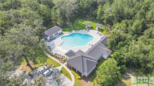 64 Southern Way, Richmond Hill, GA 31324 - aerial view of a pool area and a forest