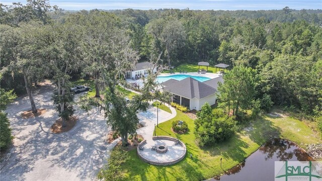64 Southern Way, Richmond Hill, GA 31324 - view of subject property with a forest, a large body of water, and a pool area