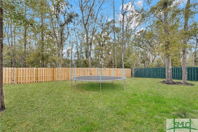 64 Southern Way, Richmond Hill, GA 31324 - view of yard featuring a trampoline