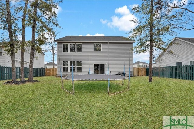 64 Southern Way, Richmond Hill, GA 31324 - rear view of house with a trampoline