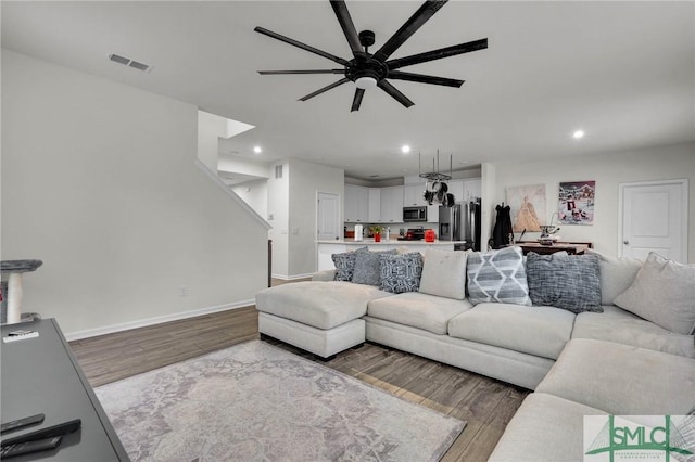 64 Southern Way, Richmond Hill, GA 31324 - living room with wood finished floors, ceiling fan, recessed lighting, and baseboards
