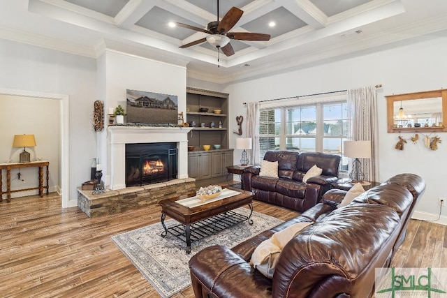 4 Honeysuckle Dr, Claxton, GA 30417 - living room featuring a towering ceiling, ceiling fan, a warm lit fireplace, crown molding, and coffered ceiling