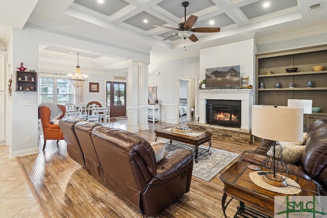 4 Honeysuckle Dr, Claxton, GA 30417 - living area with ceiling fan, ornamental molding, coffered ceiling, a glass covered fireplace, and a chandelier