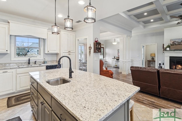4 Honeysuckle Dr, Claxton, GA 30417 - kitchen featuring ornamental molding, plenty of natural light, white cabinets, light stone countertops, and beam ceiling