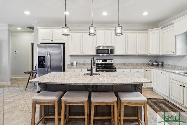 4 Honeysuckle Dr, Claxton, GA 30417 - kitchen featuring stainless steel appliances, crown molding, light tile patterned floors, a breakfast bar area, and recessed lighting