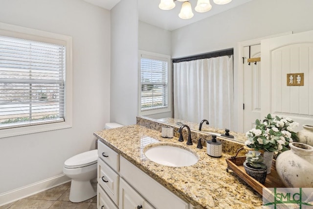 4 Honeysuckle Dr, Claxton, GA 30417 - bathroom with vanity, healthy amount of natural light, tile patterned floors, and a chandelier