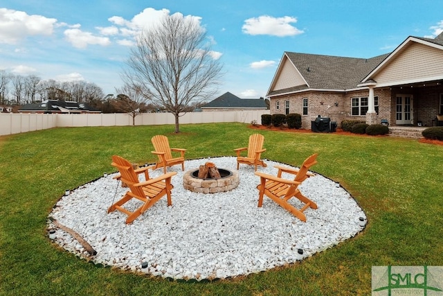 4 Honeysuckle Dr, Claxton, GA 30417 - view of yard featuring a fire pit and french doors