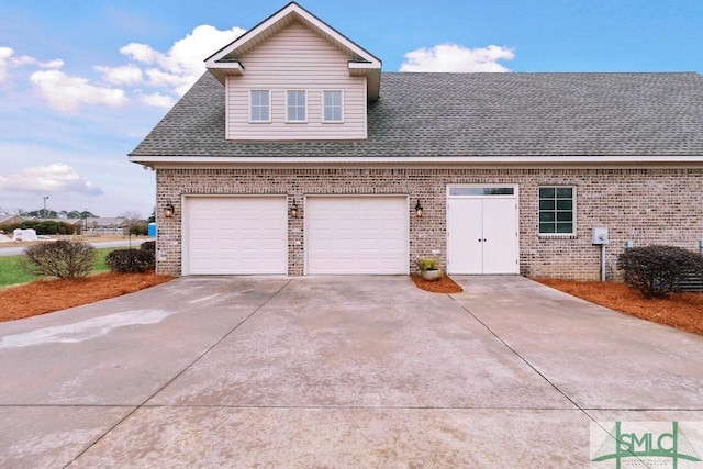 4 Honeysuckle Dr, Claxton, GA 30417 - view of front facade with brick siding, driveway, a shingled roof, and a garage