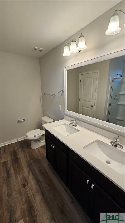 84 Marsh Salt Ln, Port Wentworth, GA 31407 - bathroom with double vanity, wood finished floors, and a shower stall