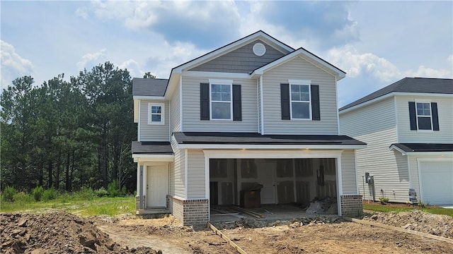 84 Marsh Salt Ln, Port Wentworth, GA 31407 - view of front of property featuring a garage, brick siding, and dirt driveway