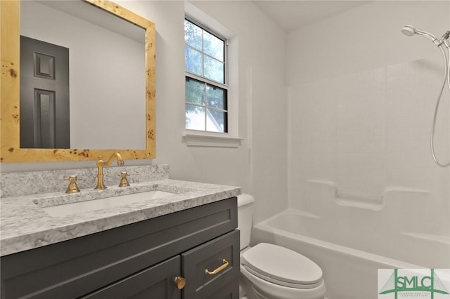 full bath featuring toilet, vanity, and bathtub / shower combination