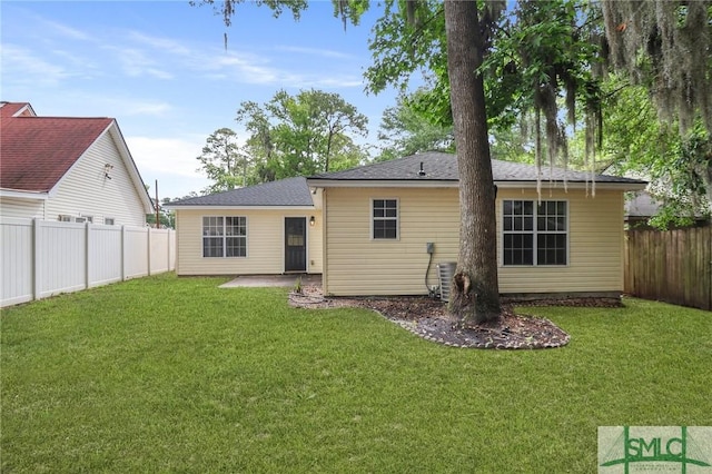 rear view of property with a patio area and a shingled roof