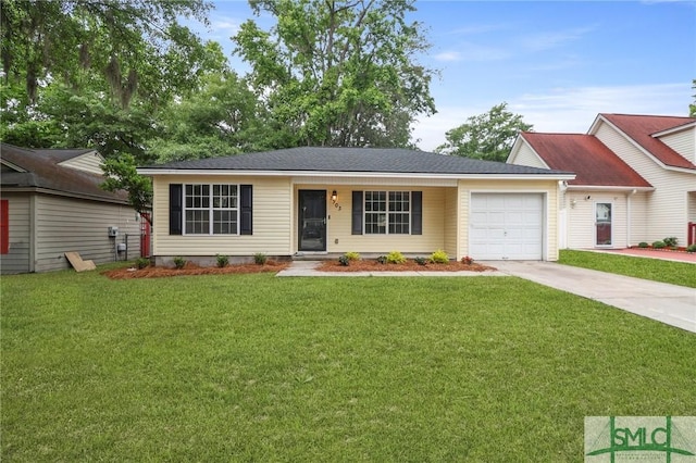 ranch-style house featuring concrete driveway, a garage, and a front yard