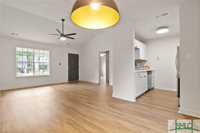unfurnished living room featuring a ceiling fan, light wood-type flooring, baseboards, and lofted ceiling