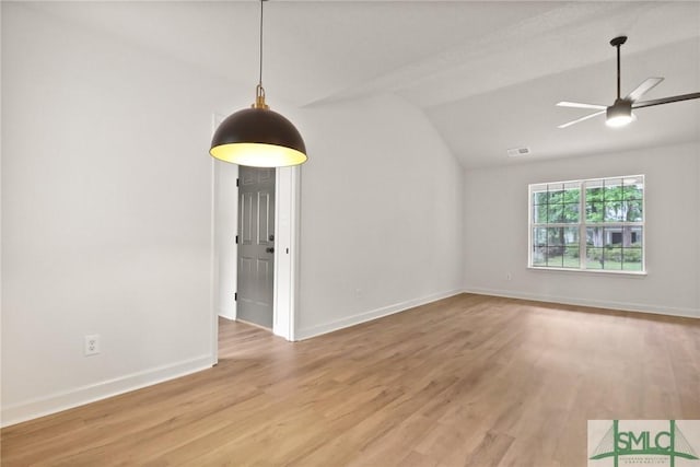 unfurnished living room with lofted ceiling, a ceiling fan, light wood-style flooring, and baseboards