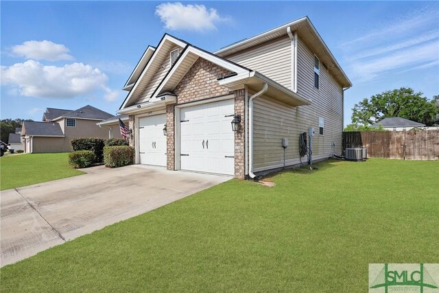309 Nashview Trl, Allenhurst, GA 31301 - view of home's exterior featuring an attached garage, driveway, cooling unit, and stone siding