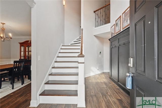 309 Nashview Trl, Allenhurst, GA 31301 - entrance foyer featuring dark wood-style floors, stairs, a chandelier, and baseboards