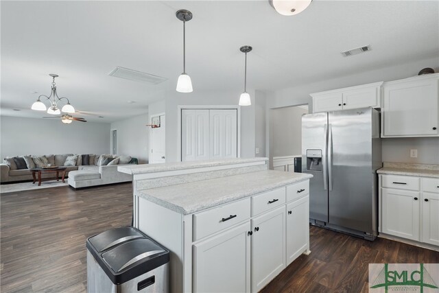 309 Nashview Trl, Allenhurst, GA 31301 - kitchen featuring stainless steel refrigerator with ice dispenser, a kitchen island, open floor plan, decorative light fixtures, and dark wood-style floors