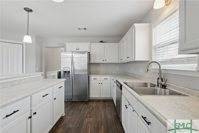 309 Nashview Trl, Allenhurst, GA 31301 - kitchen with stainless steel appliances, a sink, dark wood-type flooring, and white cabinetry