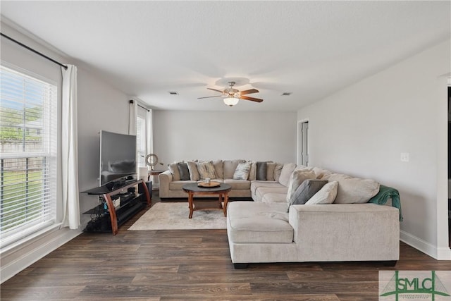 309 Nashview Trl, Allenhurst, GA 31301 - living room featuring ceiling fan, baseboards, and dark wood-type flooring