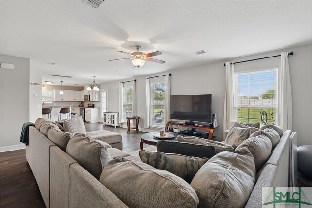 309 Nashview Trl, Allenhurst, GA 31301 - living room with a ceiling fan, baseboards, and dark wood finished floors