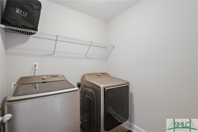 309 Nashview Trl, Allenhurst, GA 31301 - washroom with washing machine and dryer and baseboards