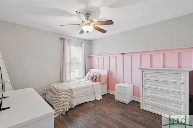 309 Nashview Trl, Allenhurst, GA 31301 - bedroom featuring wainscoting, dark wood finished floors, ceiling fan, and a decorative wall