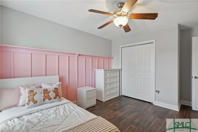 309 Nashview Trl, Allenhurst, GA 31301 - bedroom with dark wood-type flooring, a closet, wainscoting, a decorative wall, and ceiling fan