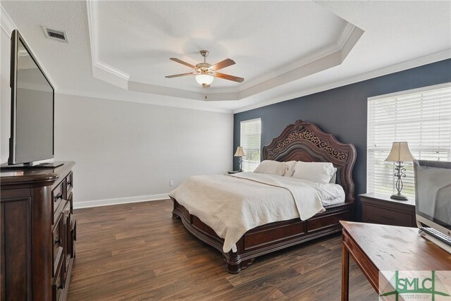 309 Nashview Trl, Allenhurst, GA 31301 - bedroom featuring a raised ceiling, ornamental molding, dark wood-style floors, ceiling fan, and baseboards