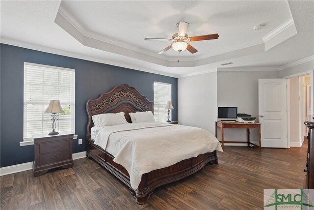 309 Nashview Trl, Allenhurst, GA 31301 - bedroom with a tray ceiling, crown molding, dark wood-type flooring, ceiling fan, and baseboards