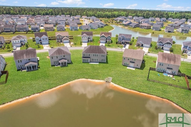 aerial perspective of suburban area featuring a large body of water
