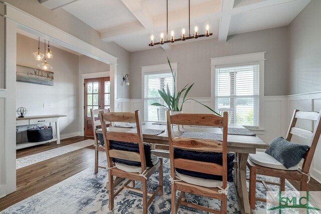 1840 Mccall Rd, Rincon, GA 31326 - dining room with wood finished floors, wainscoting, coffered ceiling, beamed ceiling, and a decorative wall