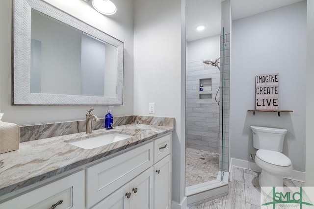 1840 Mccall Rd, Rincon, GA 31326 - bathroom with a tile shower, toilet, vanity, and baseboards