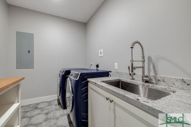 1840 Mccall Rd, Rincon, GA 31326 - laundry room featuring electric panel, cabinet space, washing machine and dryer, and baseboards