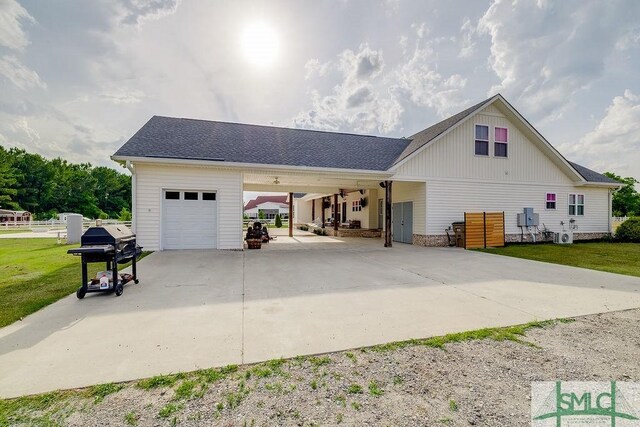 1840 Mccall Rd, Rincon, GA 31326 - view of front of house with driveway, a carport, roof with shingles, and a garage