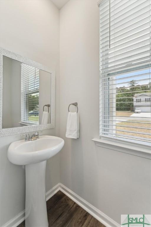 238 Sage Field Dr, Rincon, GA 31326 - bathroom featuring baseboards, wood finished floors, and a sink