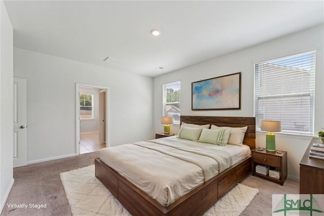 238 Sage Field Dr, Rincon, GA 31326 - bedroom with multiple windows, light carpet, and baseboards